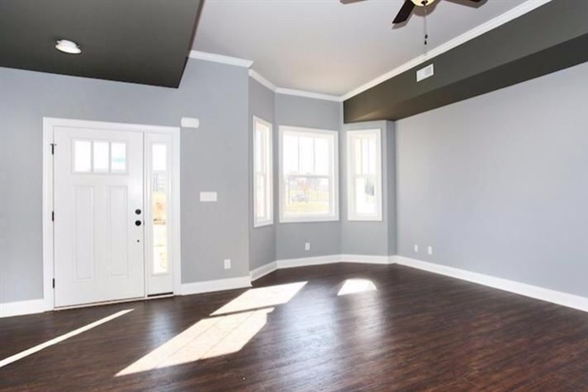 Open living space with bay windows - End-Unit Craftsman Style Townhouse in Cornerstone