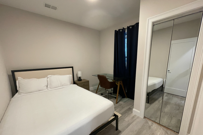 Bedroom - Renovated 5 Bed on Newport St – Open Layout, Quartz Kitchen, Deck + Mounted TV Apartments