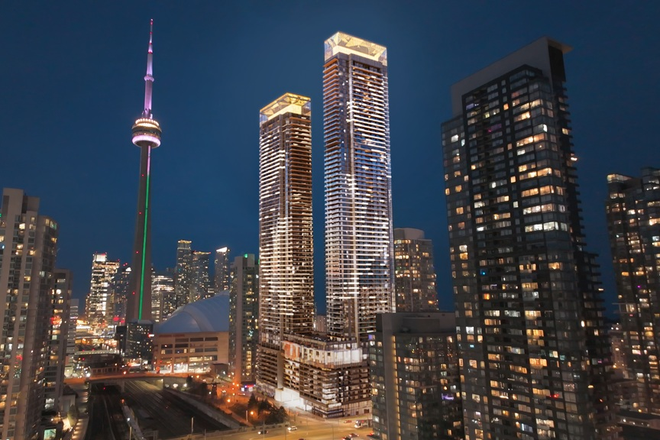 Exterior Night Aerial (Condo Towers with Maple Leaves Lightings) - Brand New 2-Bedroom condo unit with 1 Parking spot at the NE corner Bremner Blvd & Spadina Ave