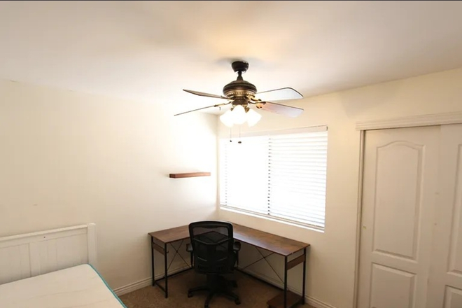 Bedroom 1 (carpet replaced with hard flooring) - The Village at University Heights Apartments