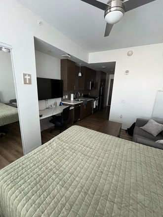 View of the living area, kitchen, tv, etc. - Life Tower Studio Apartment, 5th Floor Unit