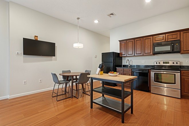 Kitchen (Note: Staged photos are digitally rendered and intended to illustrate how the unit may look furnished.) - 1204 Chestnut Apartments