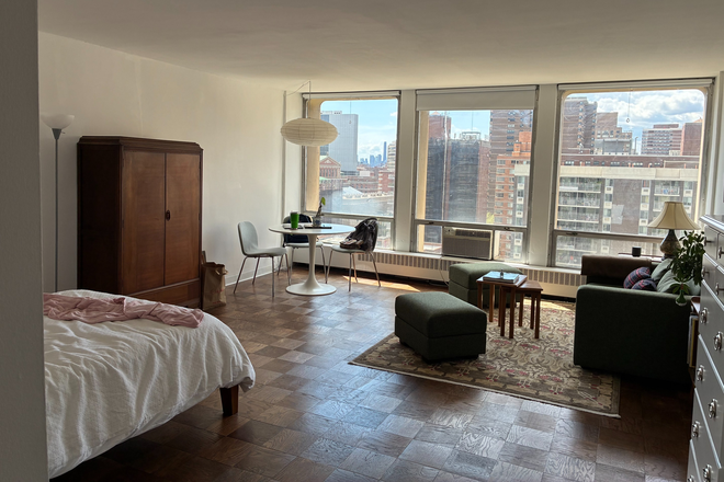 Wide view showcasing the open layout with space for living, dining, and sleeping - Oversized High-Floor Studio Opposite NYU Langone | Doorman, Gym & Open Views Condo