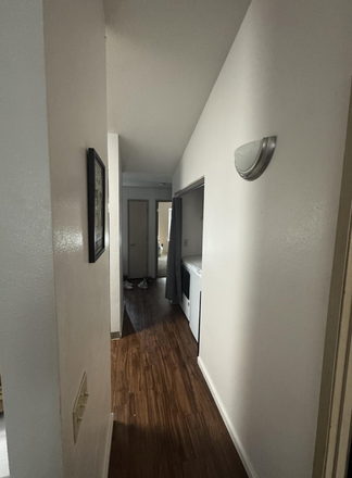 hall way between bedrooms and with washer/dryer - Chase Village Apartments