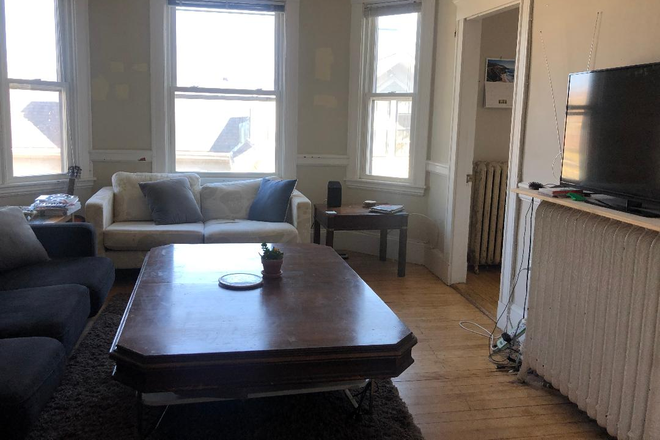 Living room - Sunny, spacious 4BR/1BA is av. September 1s., walk to Harvard T. Apartments