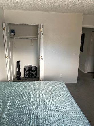 View of the closet - Townhouse near trails, easy access to campus, 1 room available now!