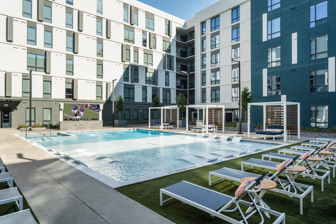 the pool area - The Otto Apartments