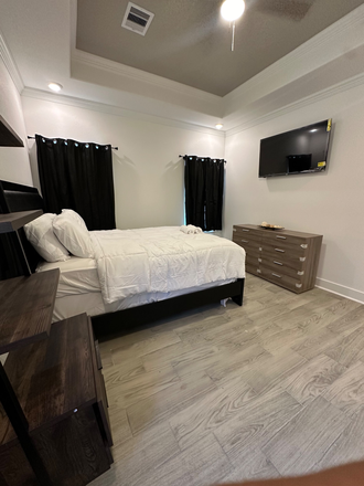 Master bedroom bed - Koaleh Homes – Furnished Rooms Near NRG & the Texas Medical Center