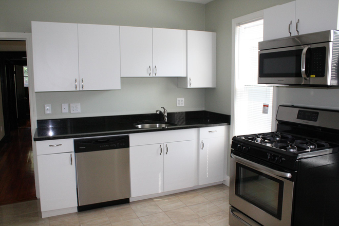 kitchen - Stainless Steel and Granite Kitchen | Hardwood Flooring Apartments