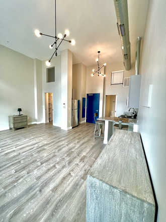 Living/kitchen space - 109 W Lexington Apartments, modern, downtown, great transportation options