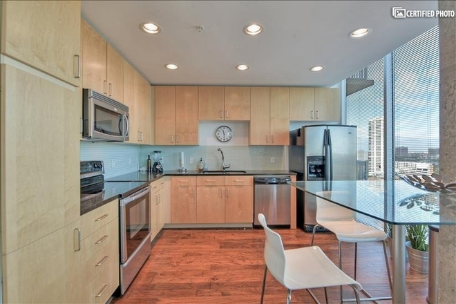 Dining room - Stylish 1-bedroom, 1-bath high-rise condominium with a stunning view of Downtown Houston