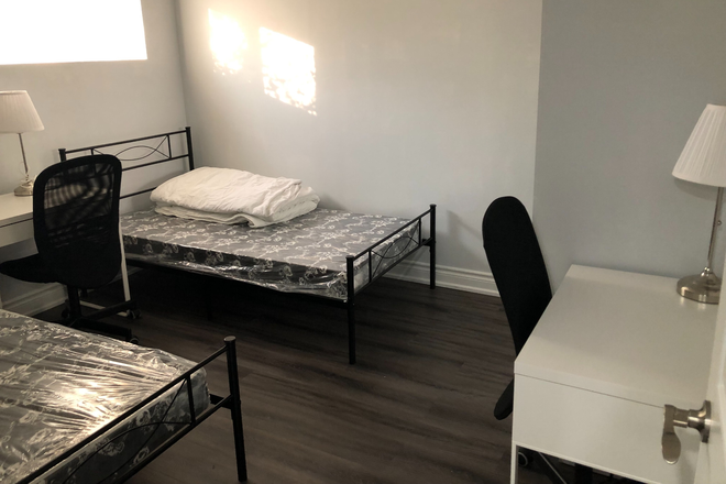 Bedroom A: $950 with Single sized bed - Private rooms for female in a shared basement at Cindy Nicholas Dr, Utilities included! House