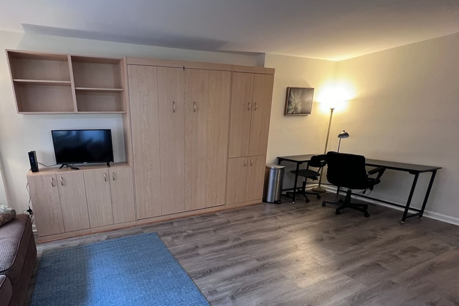 living area with Murphy bed hidden - Bright, convenient studio in the heart of DC - Apartments