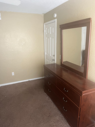 Large mirror with roomy cabinets - Spacious Bedroom, located 0.3 miles from UCF Main Campus! Apartments