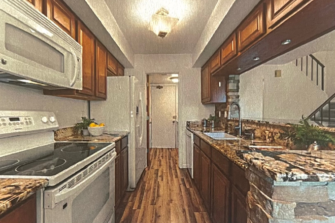 Kitchen into laundry room - 1 bedroom available in 2br townhouse across from CU east campus - Spring 2026 lease