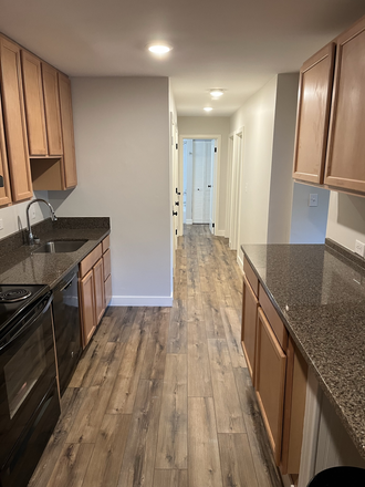 Kitchen to Hallway to Bedrooms and Bath - 2BR/1BA 1800 JPA Garden Apartments Unit. Completely Remodeled