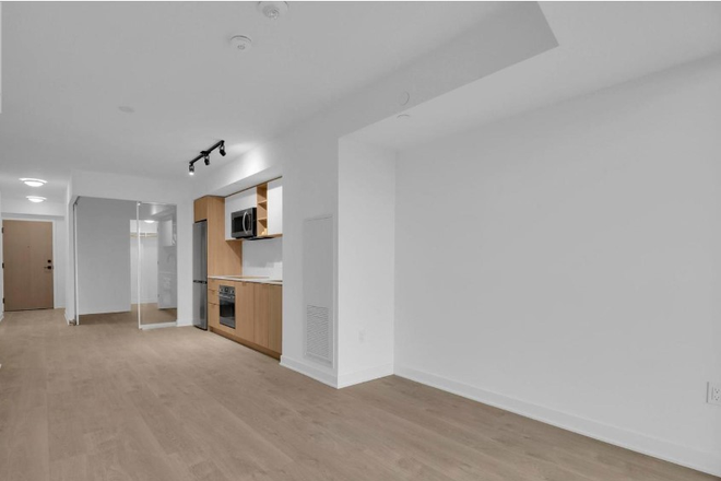dinning room & kitchen - Safe home for students 2beds 2bath + Den + locker + parking, quick Hwy access and subway transit