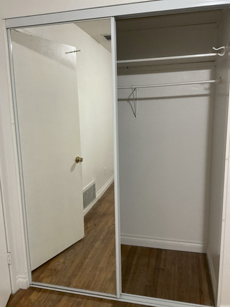 closet with sliding mirror door - Room Near Campus House