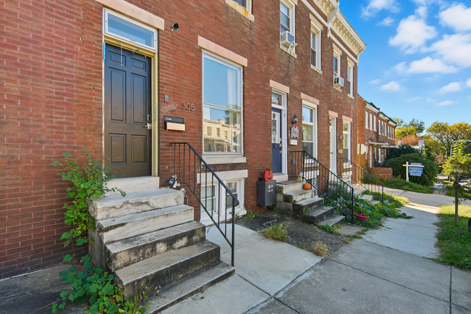 Front side of house - Solar-Powered + Furnished Townhouse w/ All Utilities Included Walking Distance from JHU