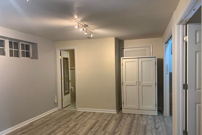 Living area - Basement Studio private entrance, full bath, kitchenette, garage parking, Across Braddock to GMU Townhome