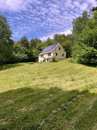 View from the bottom of the hill in the back yard - Furnished 3-bedroom N. Pomfret house-share near South Royalton on 12-month Lease