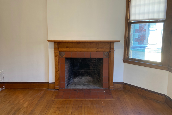 Living room fireplace - Sunny 1 Bed/1 Bath Apartment on Dana Street's "Castle" for Summer/Fall Semester