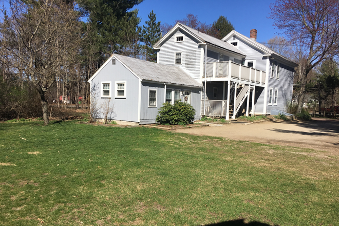 House view from backyard - Available now! 2 BR apartment, on bus route, yard, 2 car parking, 2 miles from UMass
