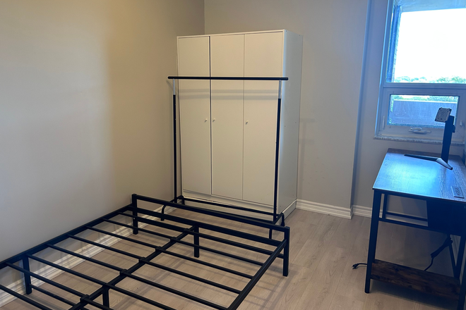 Bedroom, monitor stand for scale. - 2 Bedroom 2 Bath, fully furnished with laundry