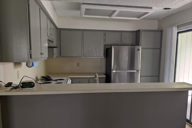 Kitchen with ample cabinet space - Impeccable with Central Location in Aggieland House