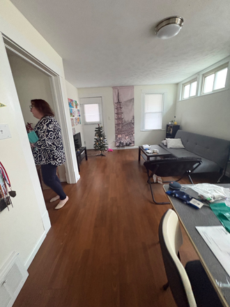 Open concept living area with door to balcony - 11426 Fairchild Ave (up), sublease close to campus Duplex