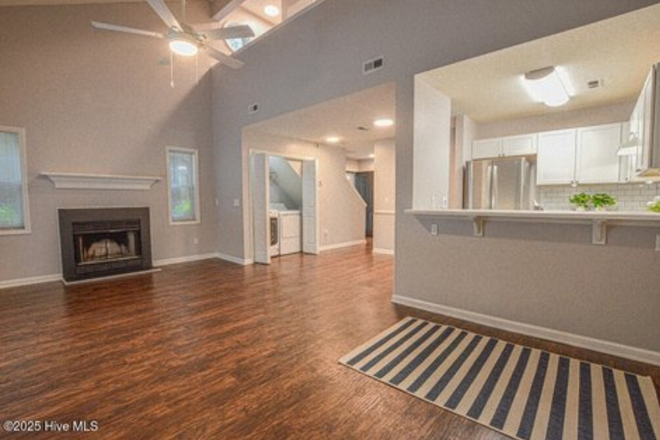 Open dining/living area - Village Square, 3 minutes from campus, parking permit eligible, red brick twin, & pool. Duplex