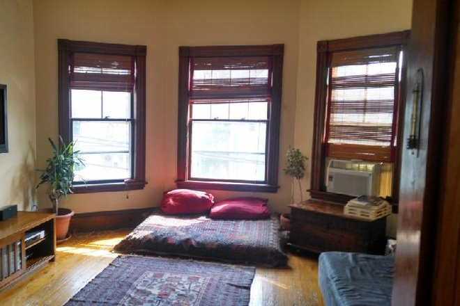 Living room - Spacious 4-Bed, 2-Bath Bi-Level Apartment Near Porter & Davis Squares. In-unit W/D.