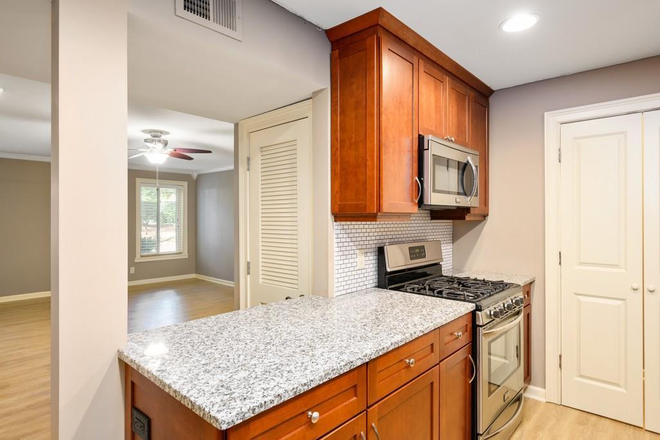 through Kitchen to see living room - Walking Distance to Emory University, VA Hospital/Emory Hospital and CDC - 2BR/2BA Condo for Rent