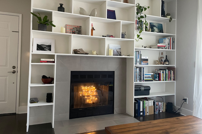 Living room with fireplace - Quiet, spacious, fully furnished 1BR/1BA in gated condo community
