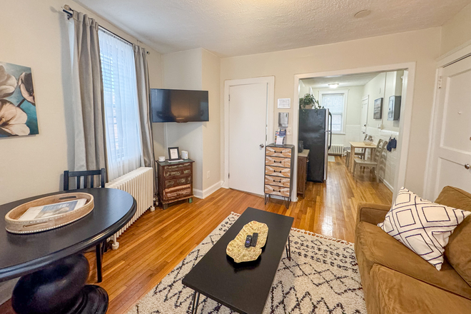 Living Room to Kitchen - KEN1915 Renovated, Furnished 1-Bed in Longwood Medical Area Apartments