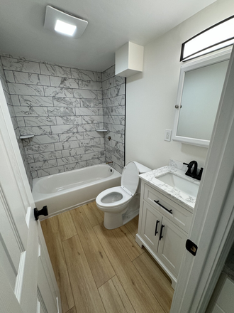 Visit hubrealtyproperties.com - Beautiful and spacious garden level studio, full kitchen with new appliances Apartments