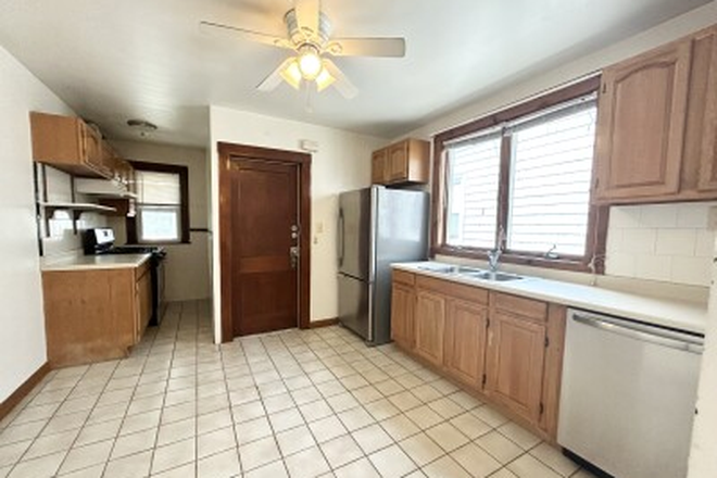 kitchen - Spacious and Sunny 3 Bed | Private Deck and Yard | Walk to Red Line Apartments