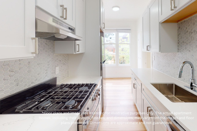 Kitchen with multiple cabinets, refrigerator, stove, range hood, and sink - 2605 Haste Street Apartments