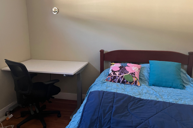 Bedroom showing large student desk and double bed. - Room for rent in quiet SW Berkeley neighborhood, 1.7 miles from campus