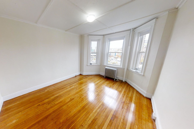 Visit hubrealtyproperties.com - Sunny studio alcove with eat in kitchen, next to Fenway Park