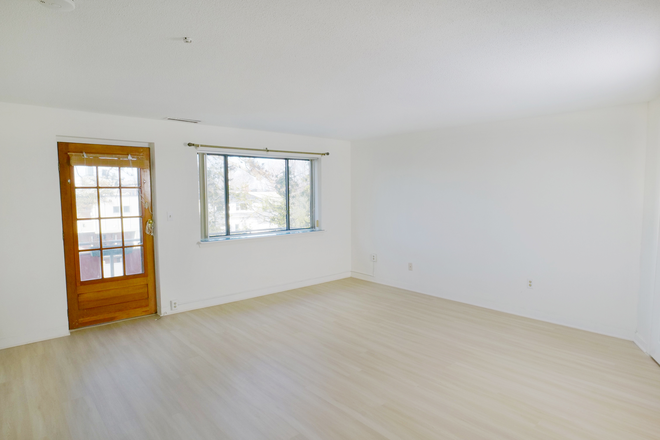 Living room - opens to balcony - Spacious 3BR, 2 Bath, Offstreet Parking, +Sunny Balcony! Condo