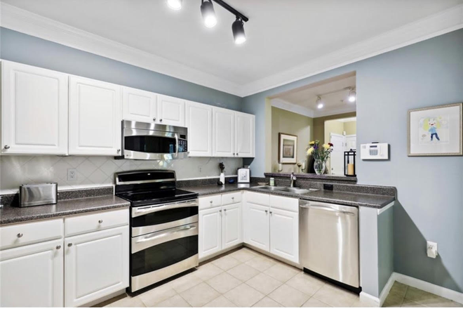 Kitchen with view of dining area - Private room and bath available minutes from Emory, groceries, Target, and I85