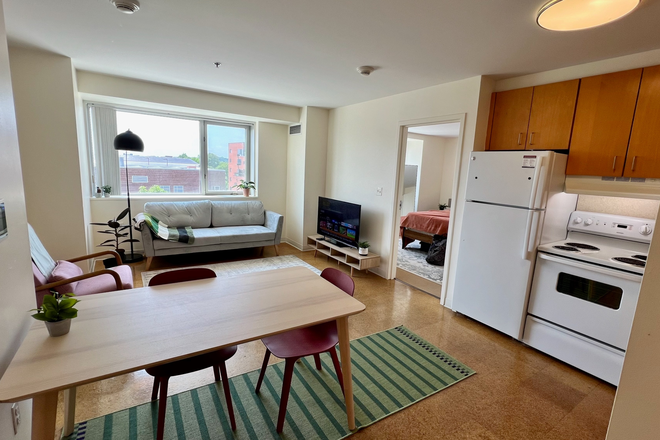 Living room 1 - One Western Ave -- furnished bedroom & private bathroom in 2BR/2BA Apartments