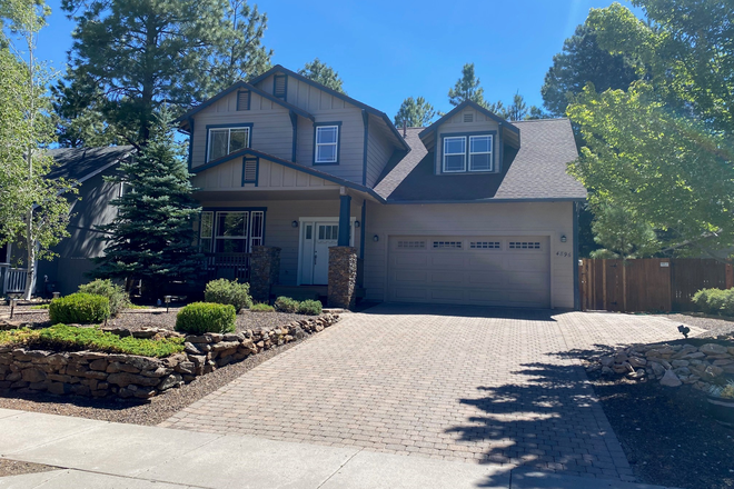 Front of house - Beautiful Home! Utilities included! 4 BR 3 full bath, Fully Furnished in Ponderosa Trials