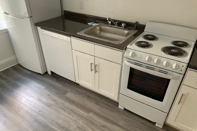 Visit hubrealtyproperties.com - Large 2 bedroom with updated eat in kitchen with dining area, and deck Apartments