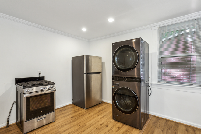 kitchen areas with washer and dryer - Garage Cottage-Studio Apartments