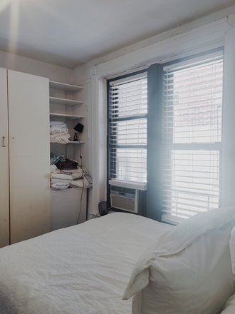 Bedroom — air conditioner in window - West Village, sunny, furnished room in shared home, August 15, for female roommate, $2,100