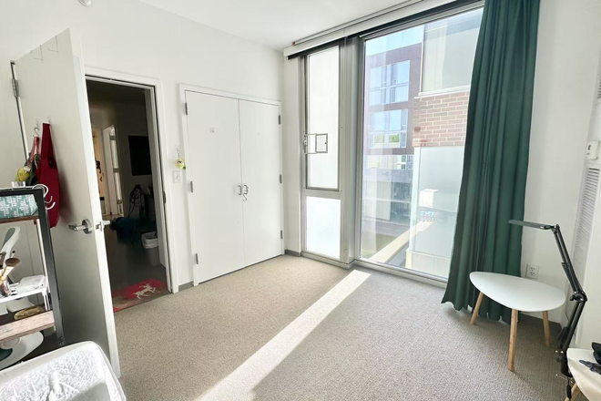 bedroom - Top-Floor Apartment with Floor-to-Ceiling Windows and Central AC