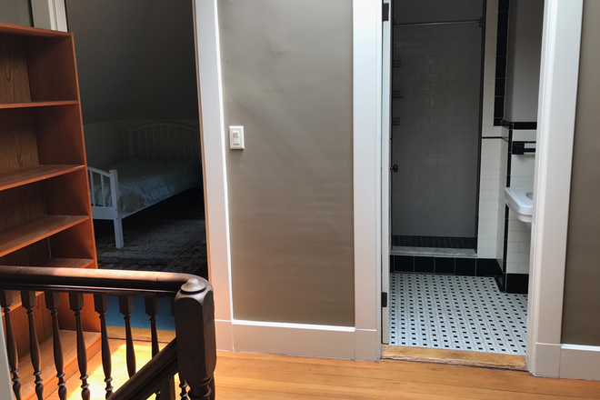 Top of stairwell with view to BR2 & Bath - Furnished Apartment in West Newton- 3rd Floor of Victorian Era Home