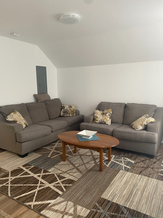 Living room. - 1 BR/1BA/Newly Built/W/D/Central Air/4mi to Campus/utilities included/on bus line/med/grad/one pers Apartments